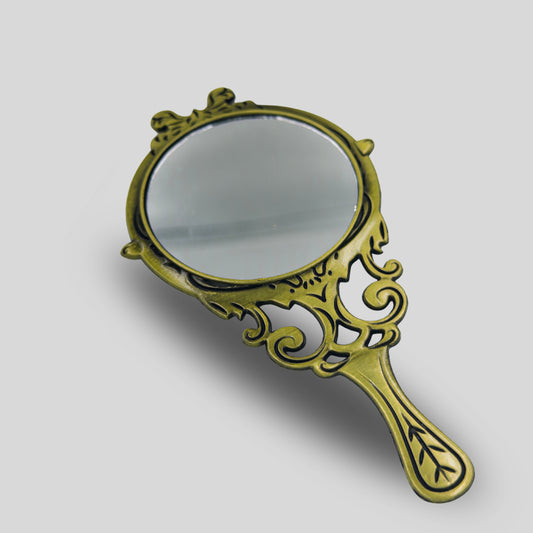 small metal antique hand mirror